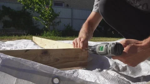 Fastens the boards with a screwdriver Stock Footage 314309111