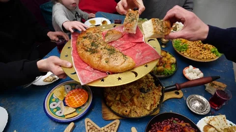 Fasting during Ramadan, Iftar time, family at the table. Authentic Middle Stock Footage 267050830