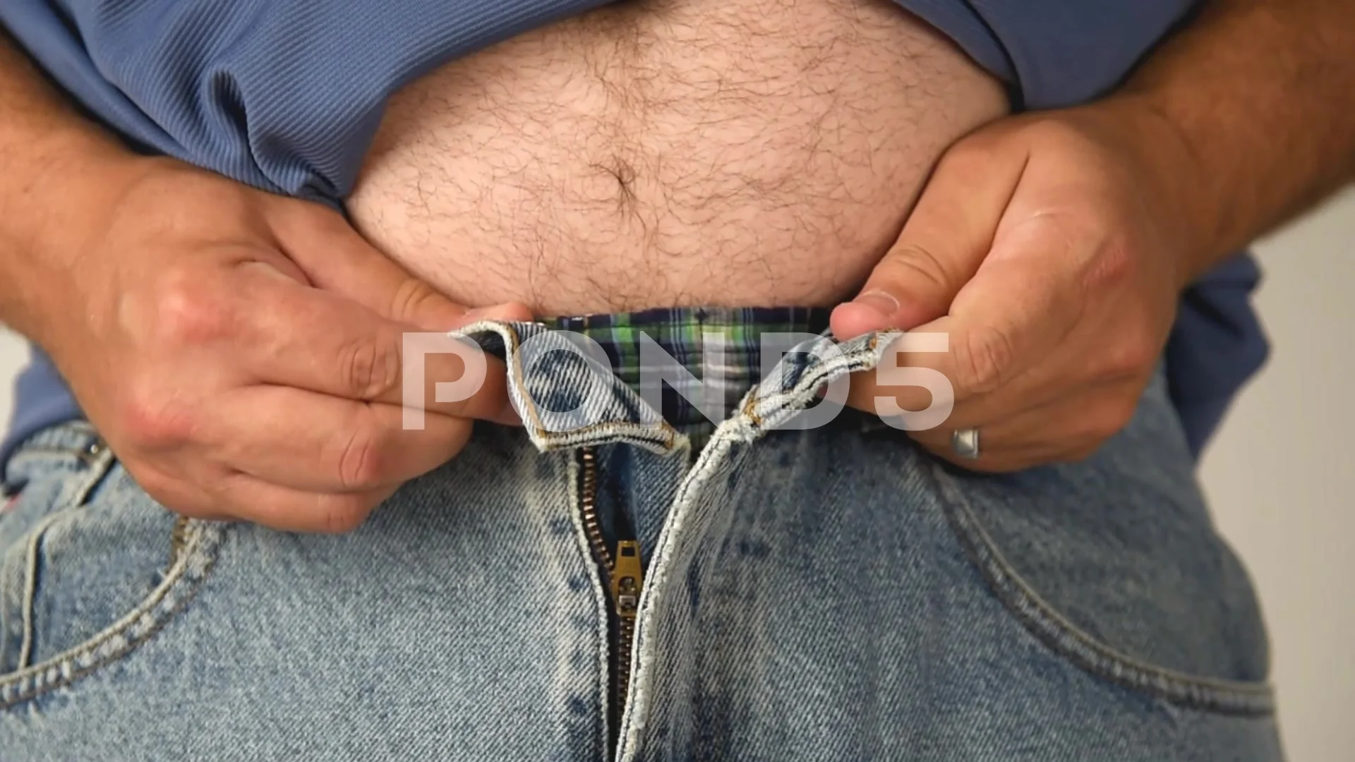Fat Belly Man Trying to Fit in Pants, Stock Video