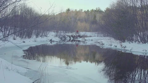 Fat bikers riding by a river Stock Footage 144781285