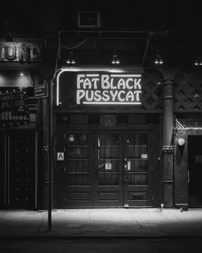 Fat Black Pussycat neon sign in the West Village, Manhattan, New York City Stock Photos