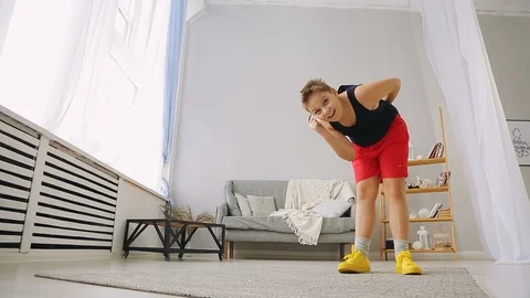 Fat boy doing exercises in the hall Stock Footage 100060829