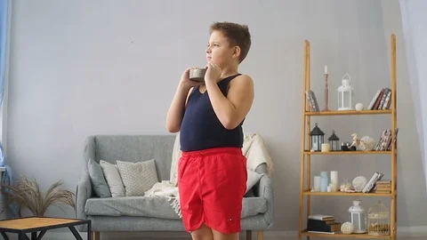 Fat boy doing exercises in the hall Stock Footage 100145278