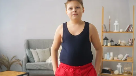 Fat boy doing exercises in the hall Stock Footage 100145676