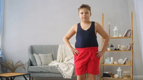 Fat boy doing exercises in the hall Stock Footage 108142863