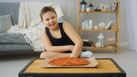 Fat boy eating pizza Stock Footage 100146469