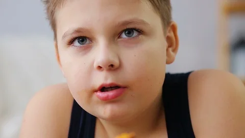 Fat boy eating pizza Stock Footage 100148738
