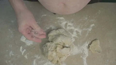 Fat chef with a bare stomach prepares the dough for dumplings. Parody and humor Video stock 153442306