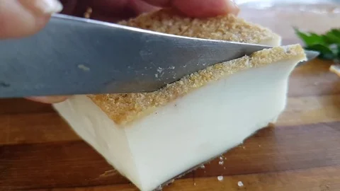 Fat, cut with a knife, slow-motion Stock Footage 95579069