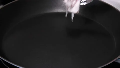 Fat is fried in a frying pan, close up Stock Footage 87586778
