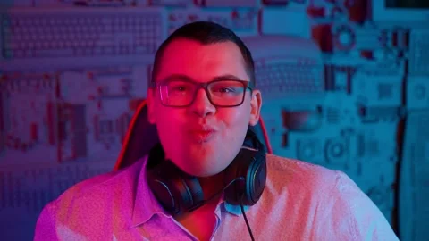 The Fat gamer plays at the computer and eats a burger and pizza. A Thick program Stock Footage 220419804