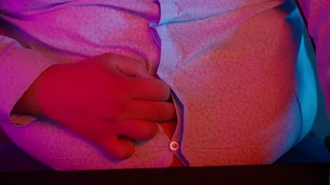 The Fat gamer plays at the computer and eats a burger and pizza. A Thick program Stock Footage 220420060