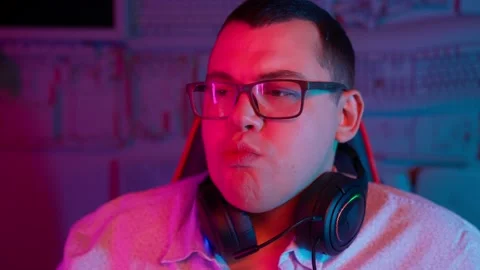 The Fat gamer plays at the computer and eats a burger and pizza. A Thick program Stock Footage 220420323