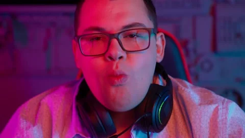 The Fat gamer plays at the computer and eats a burger and pizza. A Thick program Stock Footage 220420484
