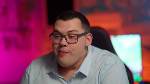The Fat gamer plays at the computer and eats a burger and pizza. A Thick program Stock-Footage 220420548