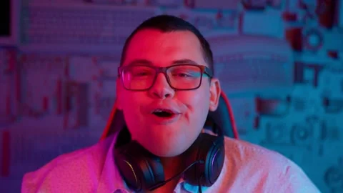 The Fat gamer plays at the computer and eats a burger and pizza. A Thick program Stock Footage 220420636