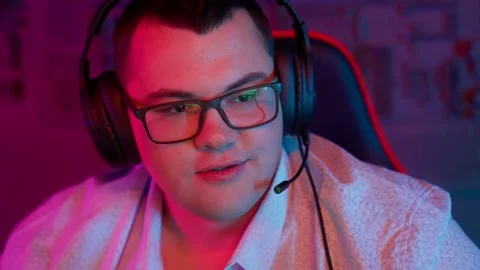 The Fat gamer plays at the computer and eats a burger and pizza. A Thick program Stock Footage 220420708