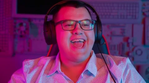 The Fat gamer plays at the computer and eats a burger and pizza. A Thick program Stock Footage 220423666