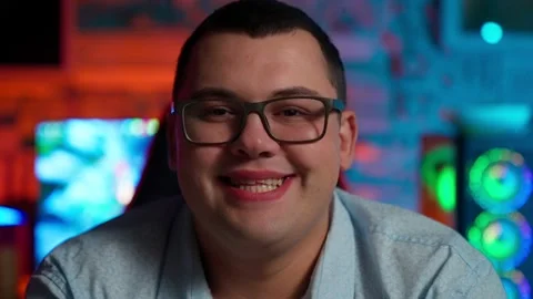 The Fat gamer plays at the computer and eats a burger and pizza. A Thick program Stock-Footage 220423811
