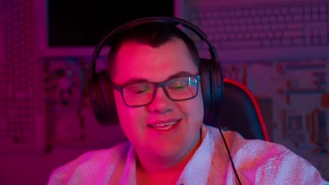 The Fat gamer plays at the computer and eats a burger and pizza. A Thick program Stock Footage 220423957