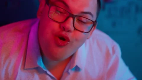 The Fat gamer plays at the computer and eats a burger and pizza. A Thick program Stock Footage 220423986