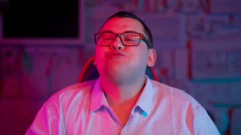 The Fat gamer plays at the computer and eats a burger and pizza. A Thick program Stock Footage 220424122