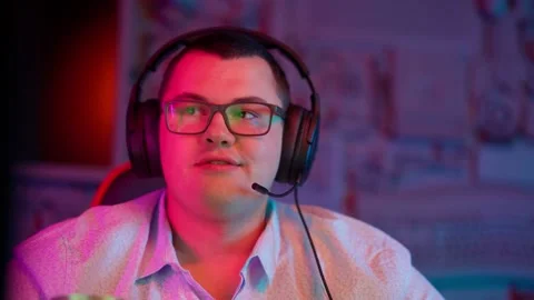 The Fat gamer plays at the computer and eats a burger and pizza. A Thick program Stock Footage 220545918