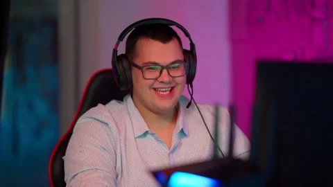 The Fat gamer plays at the computer and eats a burger and pizza. A Thick program Stock Footage 220545922