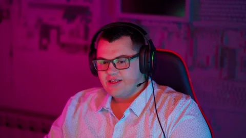 The Fat gamer plays at the computer and eats a burger and pizza. A Thick program Stock Footage 220545975