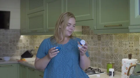 Fat girl in the kitchen Stock Footage 111587285