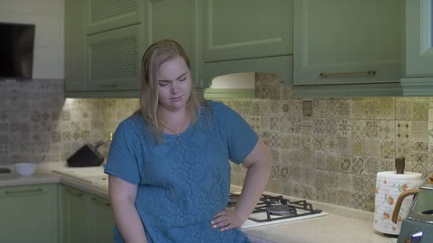 Fat girl in the kitchen Stock Footage 111587426