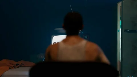 A fat guy from '90 in the dark room staring at the words displayed on the screen Stock Footage 139802540