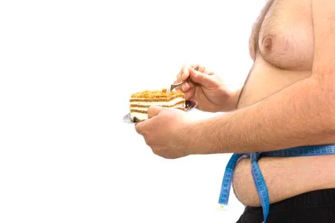 Fat guy eating cake Stock Photos