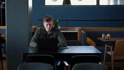 A fat IT guy writes a program, codes a mobile application, possibly a hacker Stock Footage 173464054