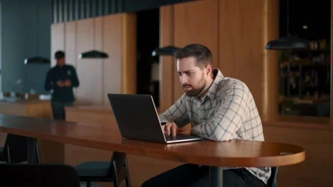 A fat IT guy writes a program, codes a mobile application, possibly a hacker Stock Footage 173479429