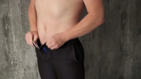 Fat man can't button your pants due to prevent stomach.Jumping and trying to Stock Footage 141900604