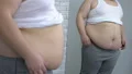 Fat man checking belly in mirror and putting on white shirt, sedentary lifestyle HD Footage