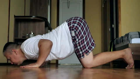 Fat man doing push-ups on his knees Stock Footage 139108795
