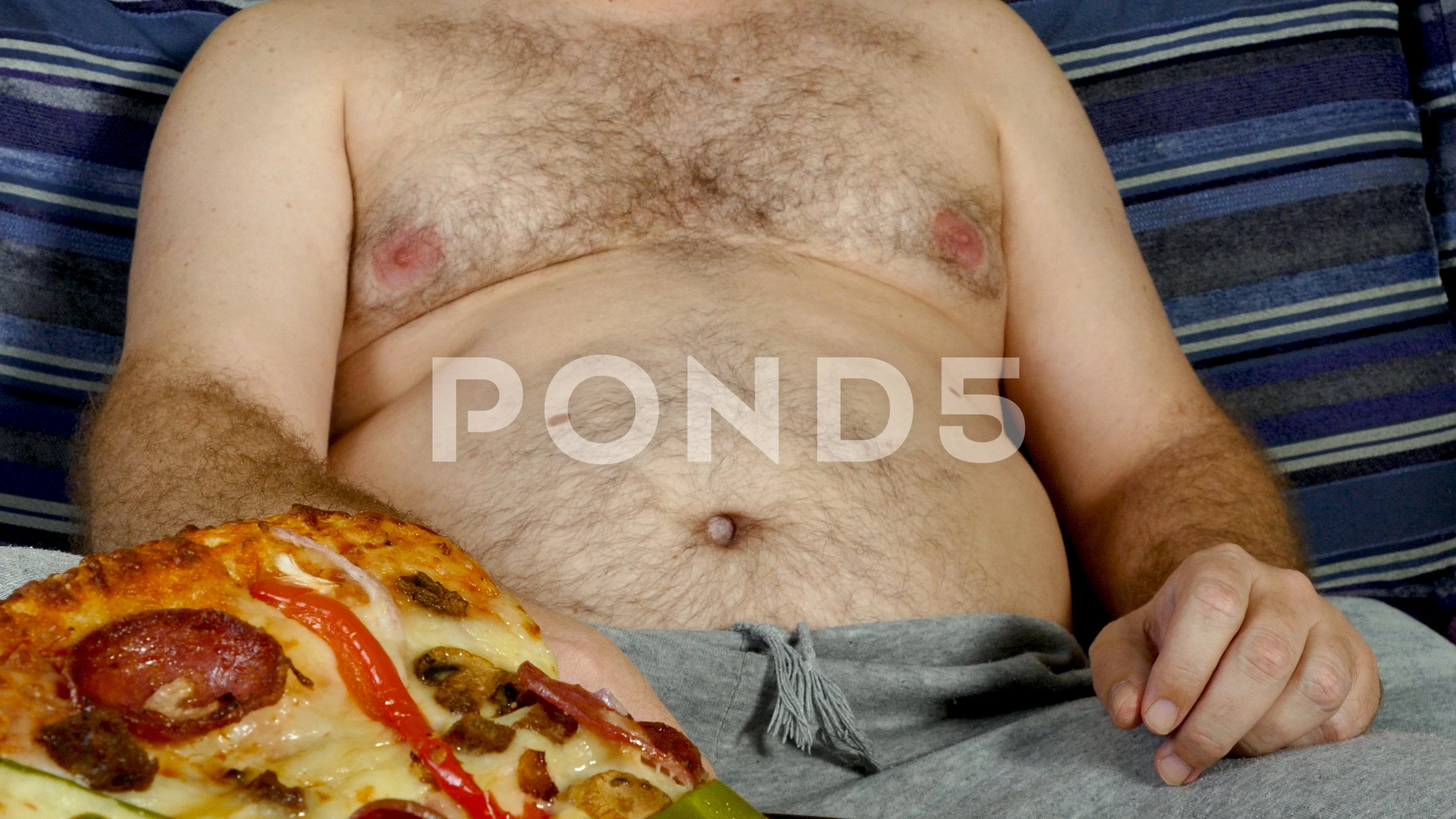 fat person eating pizza