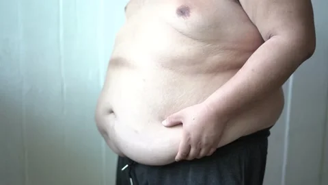 Fat man holding fat belly Stock Footage 132334530