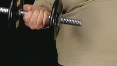 Fat Man Lifts Tiny Dumbbell 库存影片 101099119