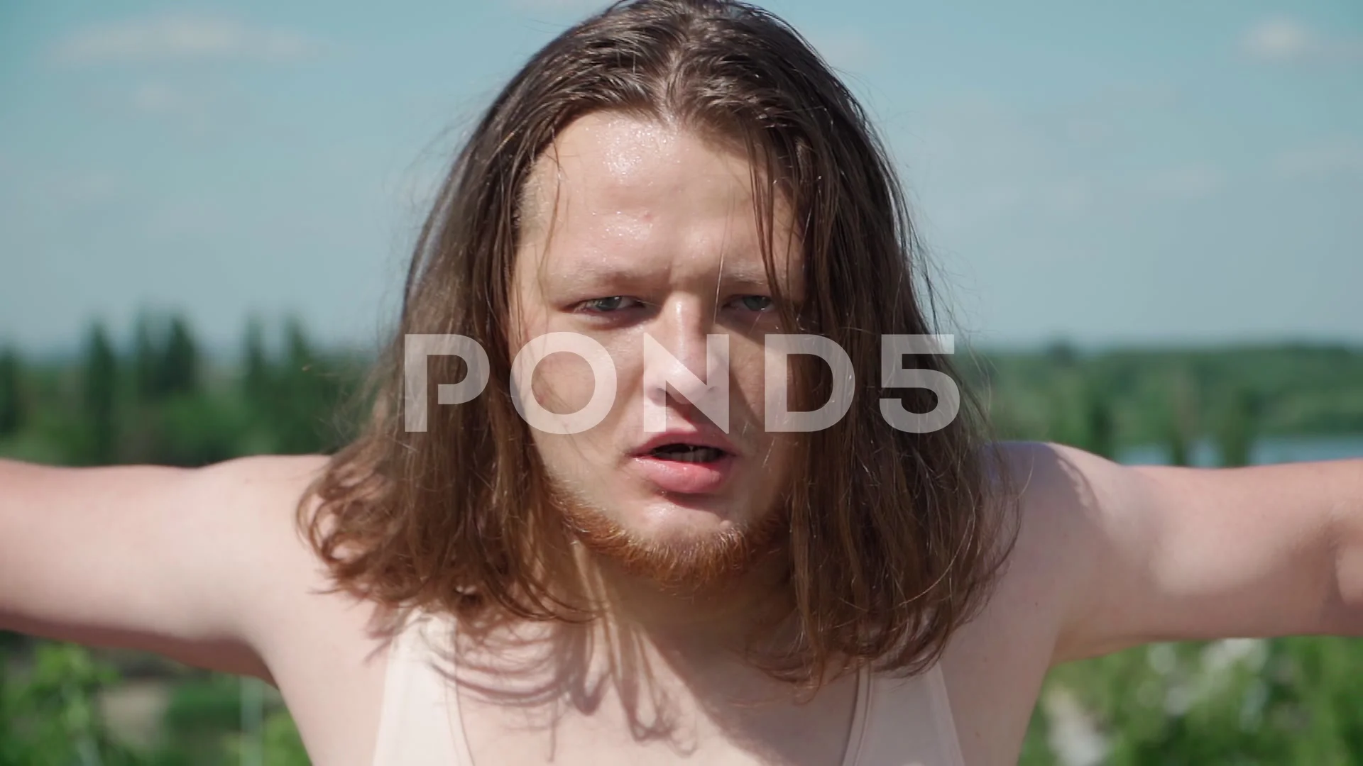 Fat Man Long Hair Does Gymnastics for We... | Stock Video | Pond5