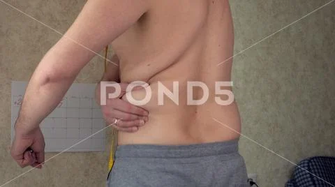 A fat man measures his waist, a big beer belly, a healthy lifestyle picks up fat Stock Photos
