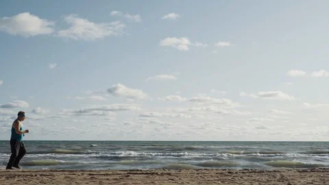 Fat Man Overweight Doing Jogging Exercises On Sandy Sea Shore Stock Footage 116631287