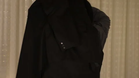 fat man in a trench coat