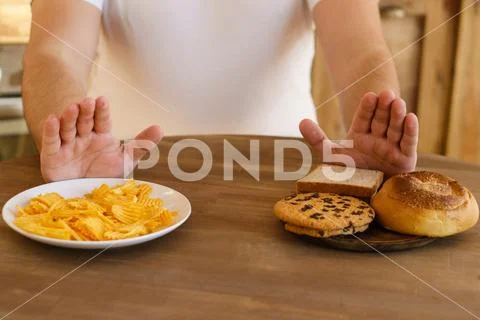 Fat man refuse to eat carbs and junk food, diet Stock Photos