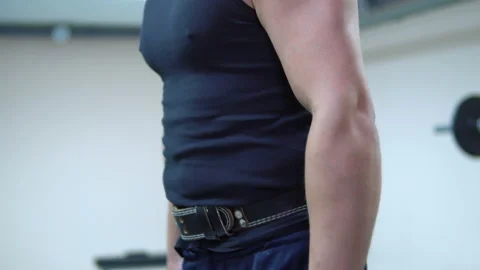 The fat man is training in the gym. Video stock 91063328
