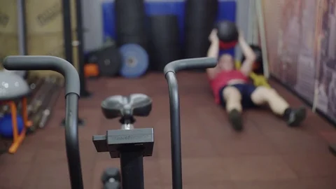 Fat man trains abs, does sit up Stock Footage 122852793