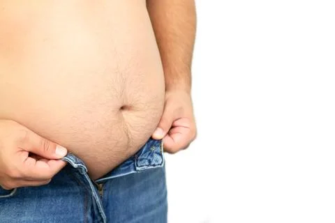 Fat man trying to button his jeans pant button because of his big belly Foto stock