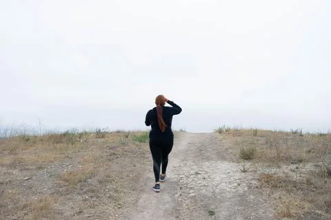 Fat model working out going up hill to lose weight Photos